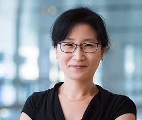 Image of woman wearing glasses and smiling